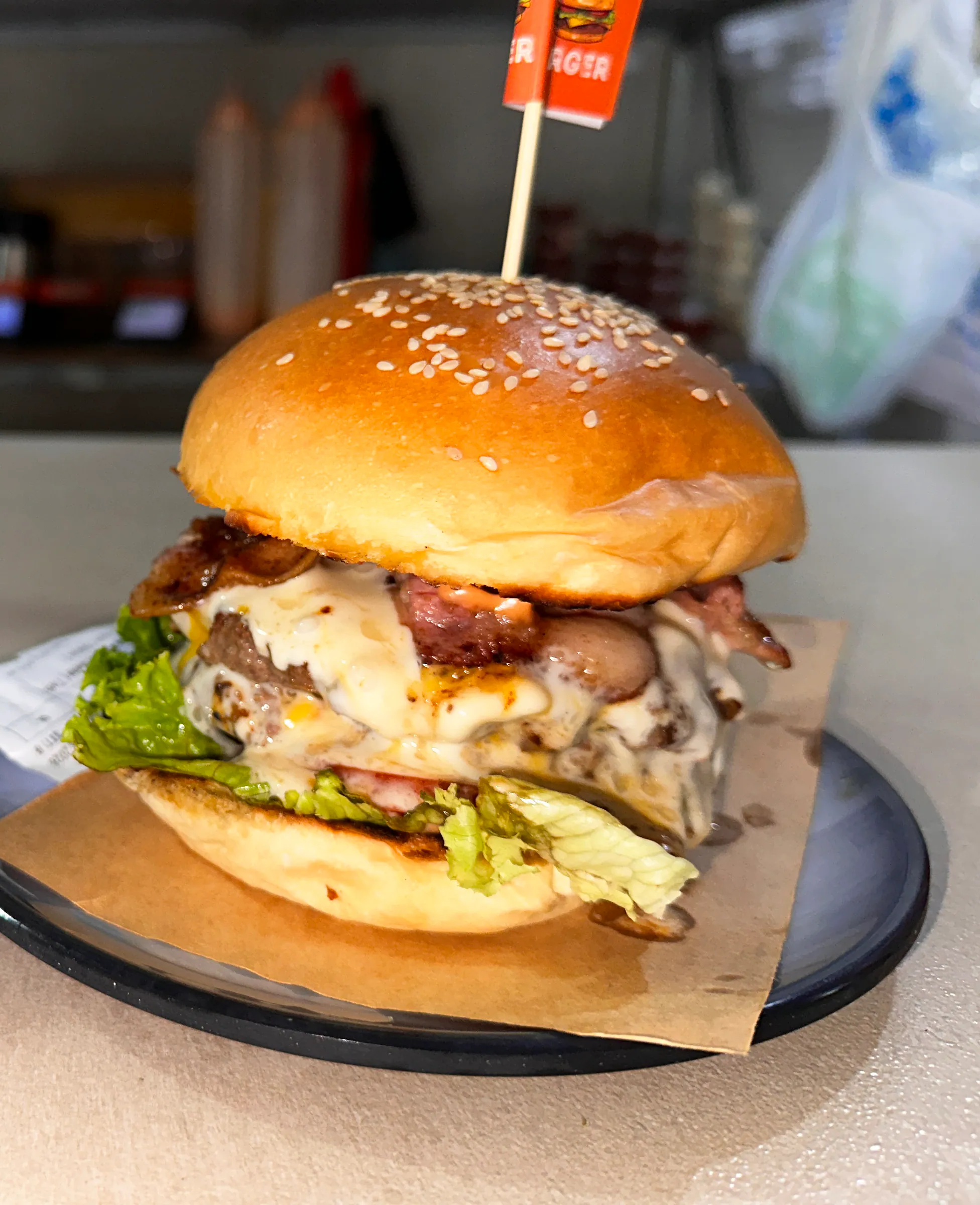 Bacon and cheese burger with a P flag, fresh from the kitchen
